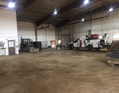 empty shop with white work truck