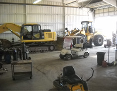 back view of excavator in shop