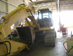 Lifts and construction machinery in yard line up