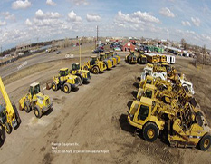 arieal view of excavators and loaders in yard