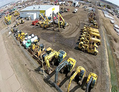 panoramic view of all machinery for sale in yard with shop