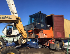 outside shop, loading equipment in trailer