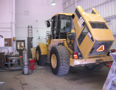 inside of shop with construction equipment