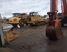 outside of shop, 2 loaders
