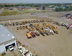 construction equipment in front of store in yard